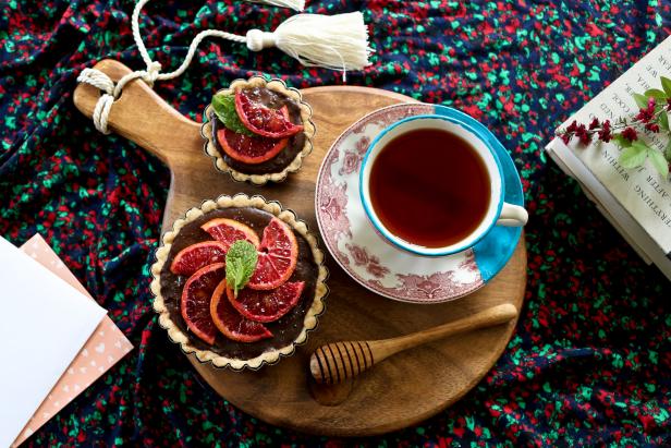 blood orange tarts and tea on serving tray