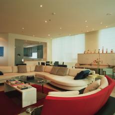 Apartment Living Area Features Warm Splashes of Red