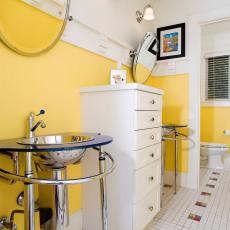 Striking Yellow Bathroom Boasts Modern Console Sinks