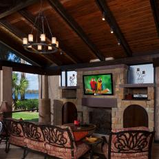 Tuscan-Style Outdoor Living Room Boasts Fireplace & TV