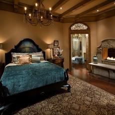 Elegant Mediterranean Bedroom With Cast Stone Fireplace