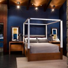 Contemporary Bedroom With Deep Blue Accent Wall