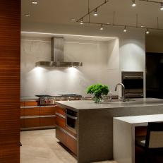 Contemporary Kitchen With Waterfall Island Countertop