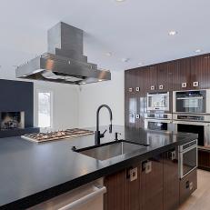 Contemporary Brown Kitchen Island With Thick Black Countertop