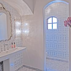 Chic Bathroom With Geometric-Patterned Accent Walls
