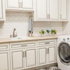 Lovely White Laundry Room With Subway Tile Backsplash