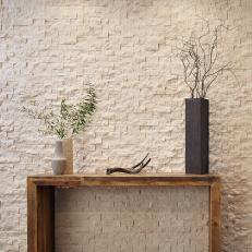 White Limestone Wall and Wood Table