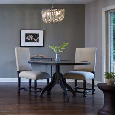Gray Dining Area With Beaded Chandelier