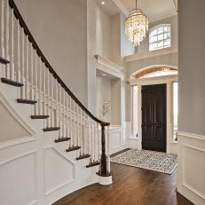 Traditional Gray Foyer With Spiral Staircase and Wall Panels