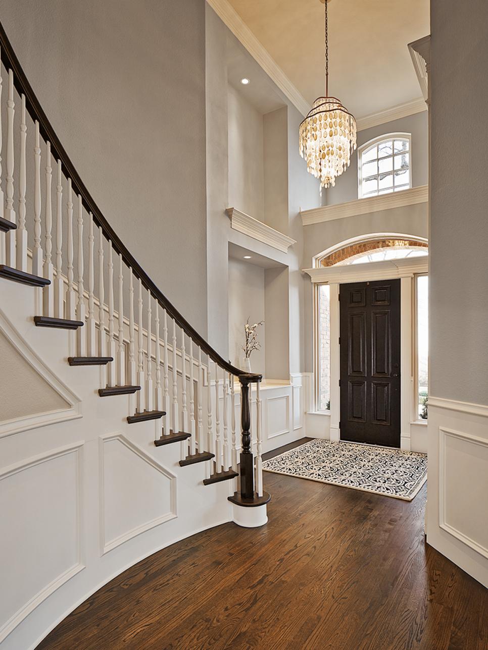 Traditional Gray Foyer With Spiral Staircase and Wall Panels | HGTV