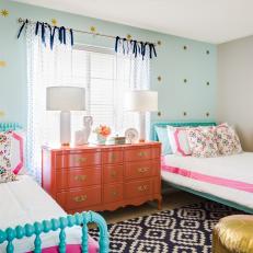 Shared Girl's Room With Aqua Accent Wall and Coral Dresser 