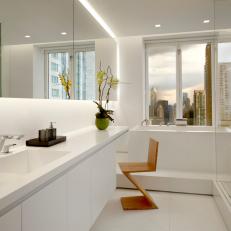 Modern White Bathroom With Tub Overlooking Scenic City View