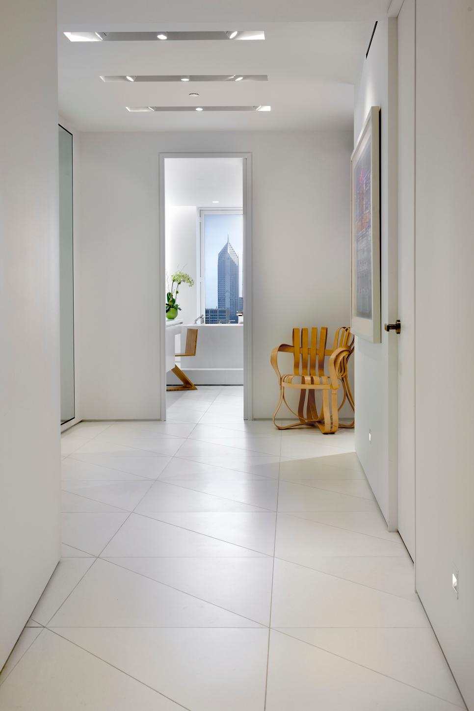 Modern White Hallway With Triangular Tile Floor | HGTV