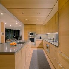 Modern Kitchen With Light Wood Cabinets and Gray Countertops