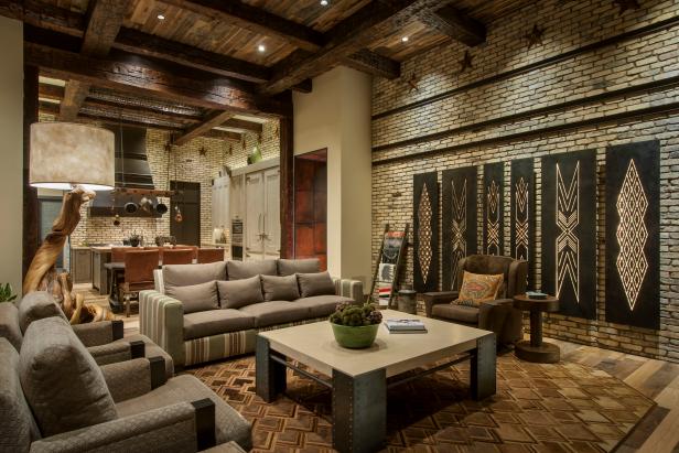 Rustic Great Room With Wood Ceiling and Brick Wall
