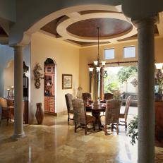 Mediterranean Dining Room with Vaulted Ceiling