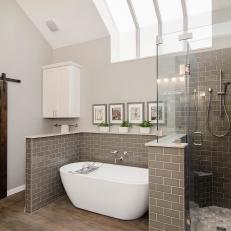 Gray and White Transitional Bathroom With Skylight