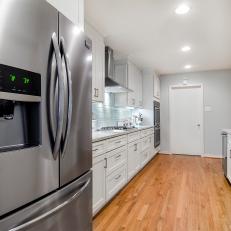 White Kitchen With Stainless Steel Refrigerator