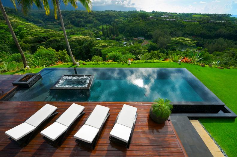 Modern Infinity Pool With Integrated Hot Tub Overlooks Lush Valley
