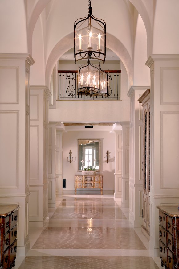 Traditional Neutral Hall With High Ceilings & Lantern-Style Pendants