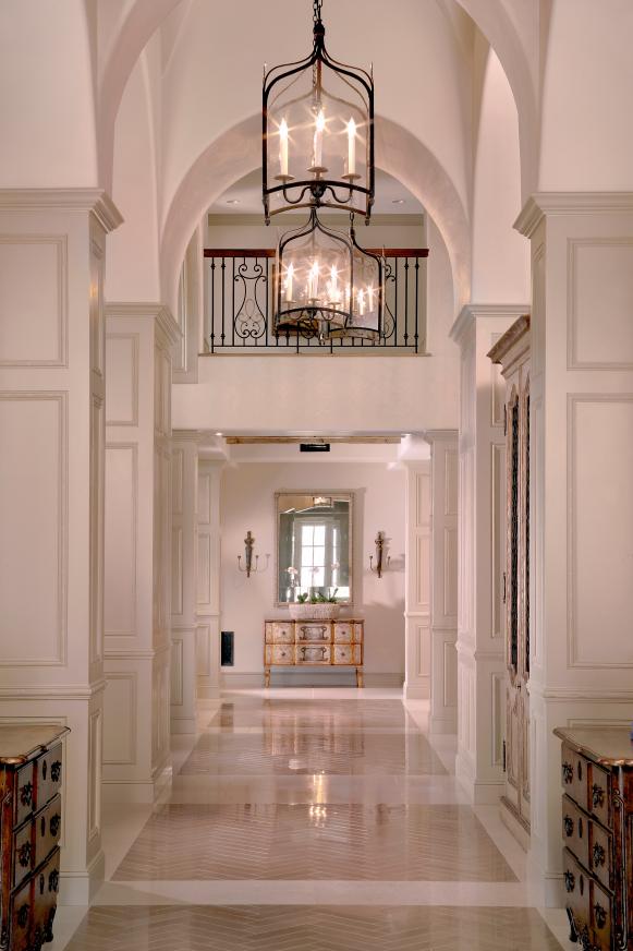 Traditional Neutral Hall With High Ceilings & Lantern-Style Pendants