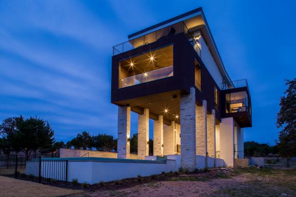 Night View of Contemporary Home Exterior With Stone Columns