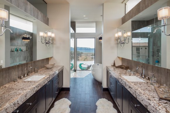 Contemporary Bathroom With Two Brown Vanities & Granite Countertops