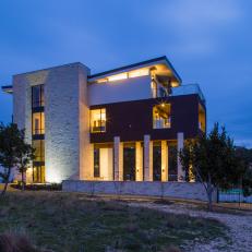 Contemporary Home Exterior at Night Is Sleek, Striking