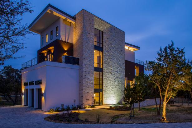 Contemporary Stone and Stucco Home Exterior at Night