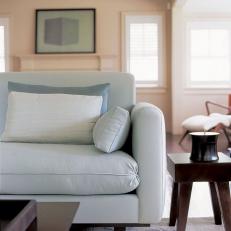 Transitional Living Room Boasts Sleek, Stylish Blue Sofa