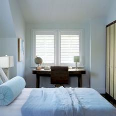 Soft Blues Create Serene Atmosphere in Transitional Bedroom