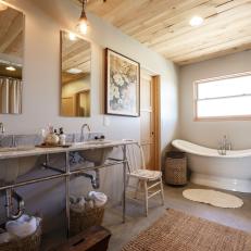 Stylish Master Bathroom Features Exposed Plumbing