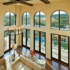 Mediterranean Living Room Boasts Grand Two-Story Ceilings