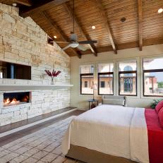 Striking Master Bedroom Features Stone Accent Wall