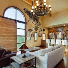 Mediterranean Family Room With Cozy Seating and Bar