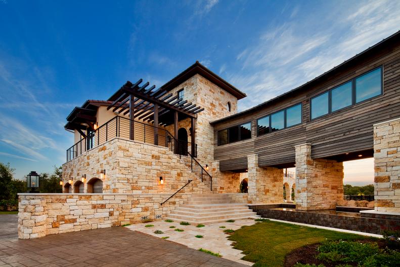 Mediterranean House Exterior With Stone, Stucco and Reclaimed Wood