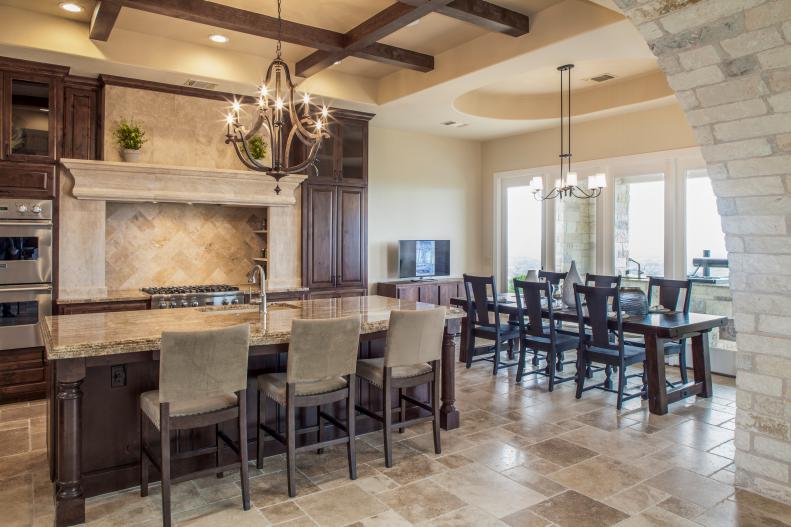 Mediterranean Eat-In Kitchen With Island and Travertine Tile Floors