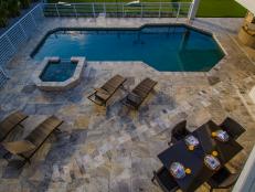 Contemporary Tile Patio Features Sleek Swimming Pool