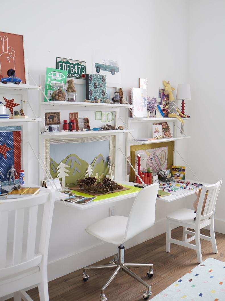 Trendy Kids' Room With Hanging Desks and Toys