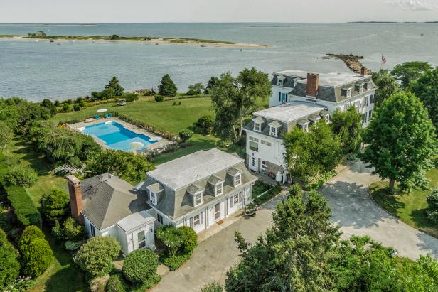 Aerial View of Waterfront Estate With Victorian Houses & Swimming Pool