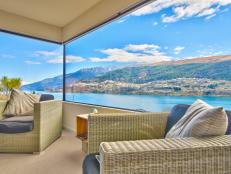 Contemporary Sitting Area With Wicker Armchairs & Lake View