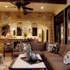 Transitional Living Room With Stone Accent Wall and Large Brown Sectional 