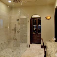 Sophisticated Traditional Bathroom With Large Glass Shower and Arched Doorways
