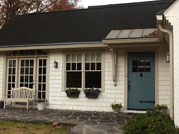 Cape Cod-Style House With Shake Shingle Siding and a Blue Door