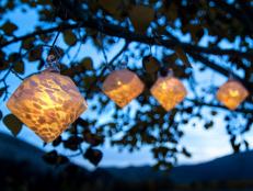 Glass solar string lights can be stunning in the canopy of trees, above an arbor, or hanging from a porch or deck. The Aurora Glow light set, by Allsop Home & Garden, is made of hand-blown glass that is illuminated at dusk.