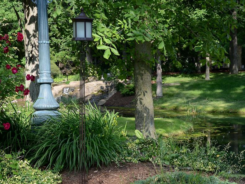 If you don't want to use torches in your yard, but seek lighting with height, consider a solar-powered pole lantern. This one, by Starlite Garden and Patio Torche Co., is made of die-cast aluminum in a weathered brown color and six glass panels. The pole lantern stands up to 60 inches tall, with no wiring.