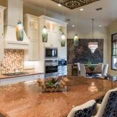 Transitional Eat-In Kitchen Features Copper Marble Countertops and Colorful Pendant Lights 