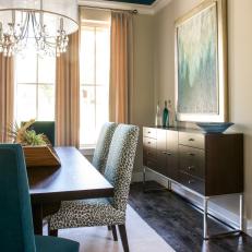 Contemporary Dining Room With Teal Ceiling and Patterned Dining Chairs 