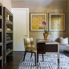 Home Office Features Greek Key Rug, Yellow Accents and Upholstered Bookcases