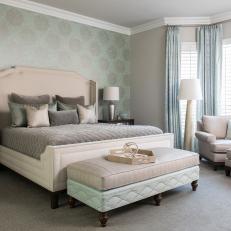 Master Bedroom Features Seafoam Green Accent Wall & Plush Neutral Furniture